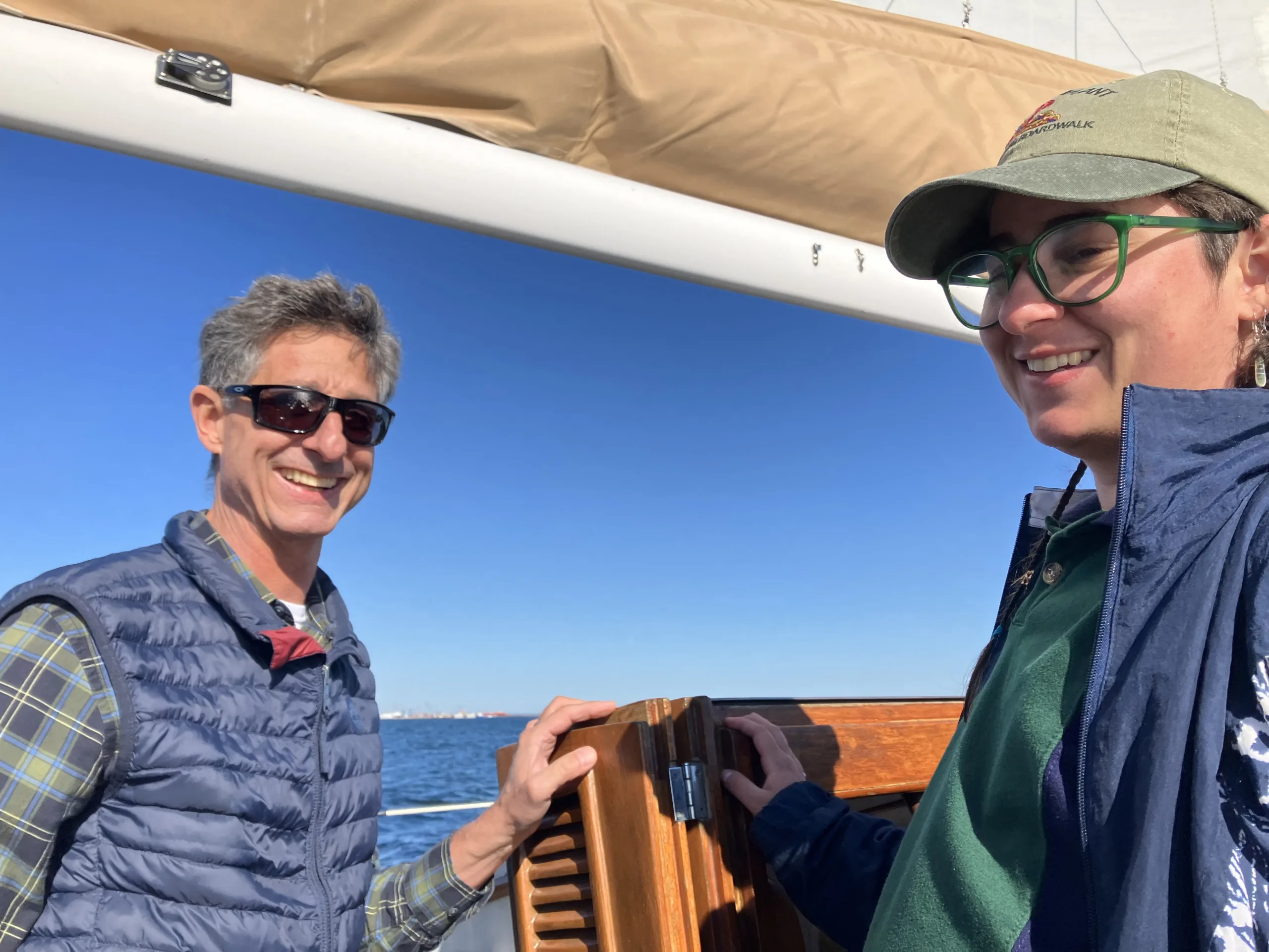two people smiling on a boat