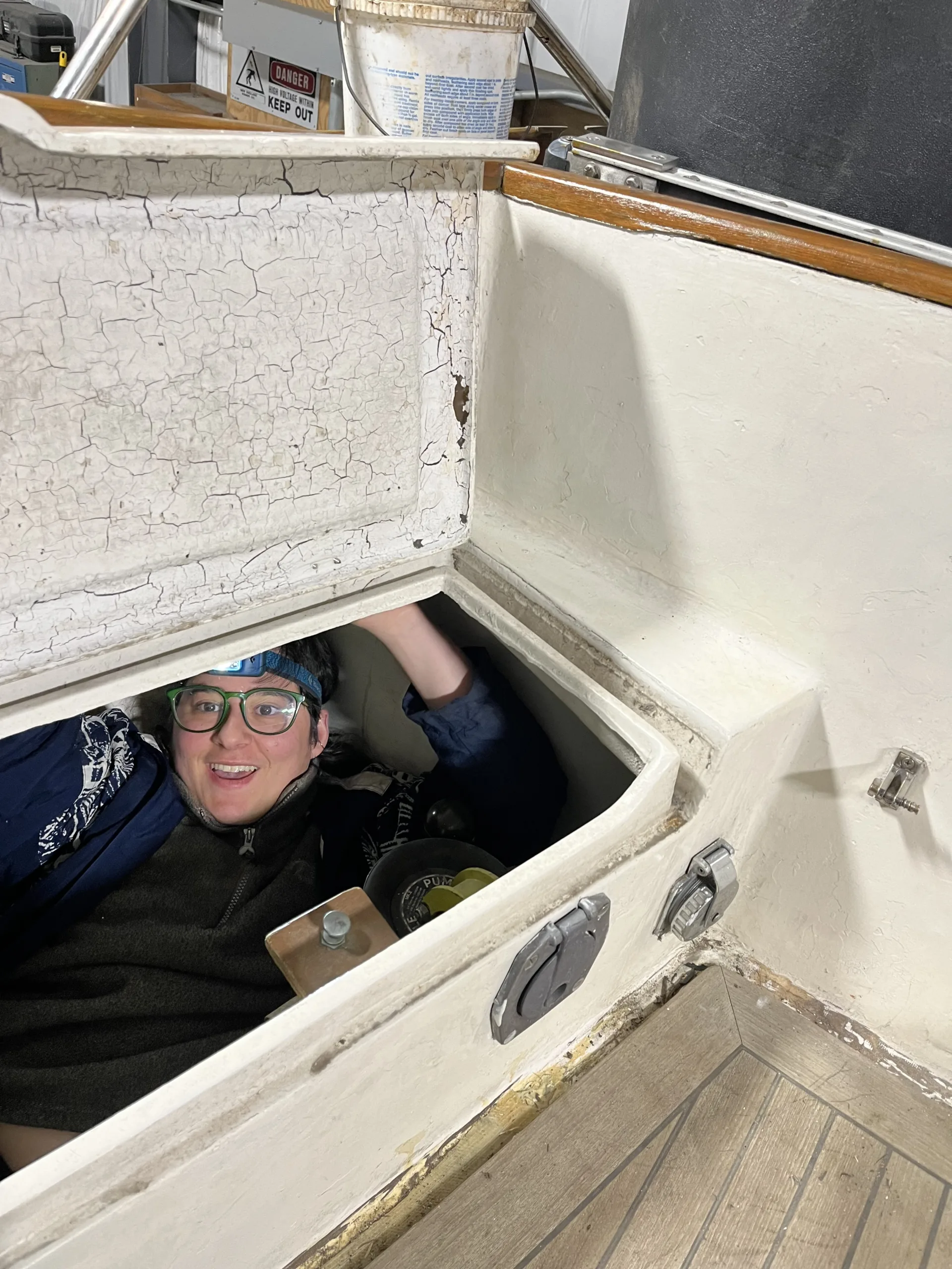 sel in a hatch of the boat cockpit